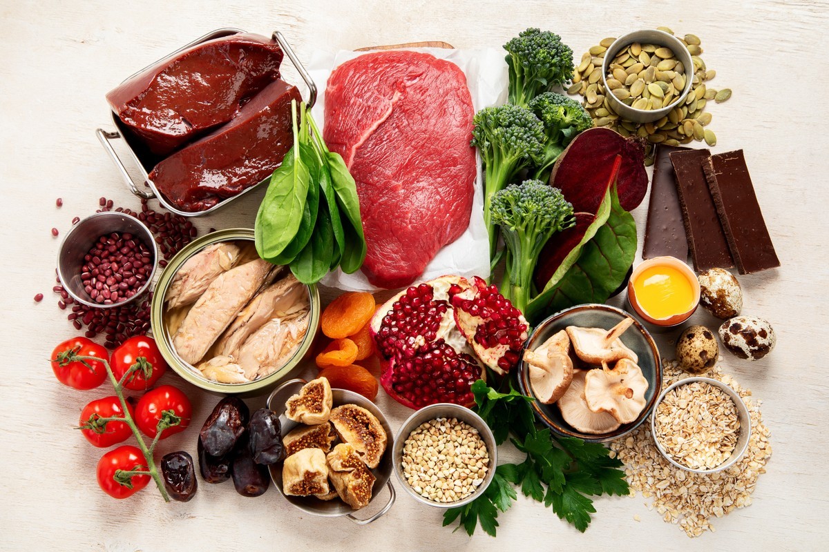 Colorful array of fresh foods on a table, ready for meal preparation.