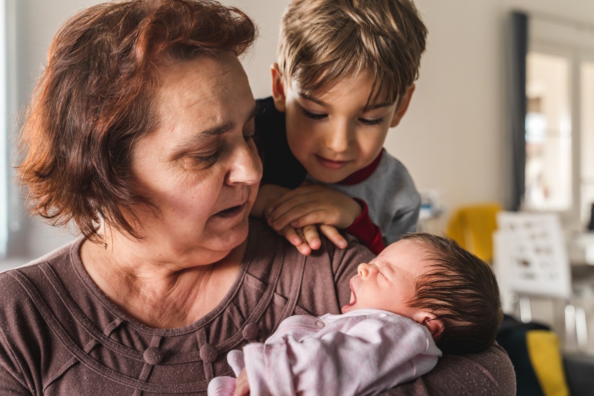 Two adults with baby, a young boy and an older woman.