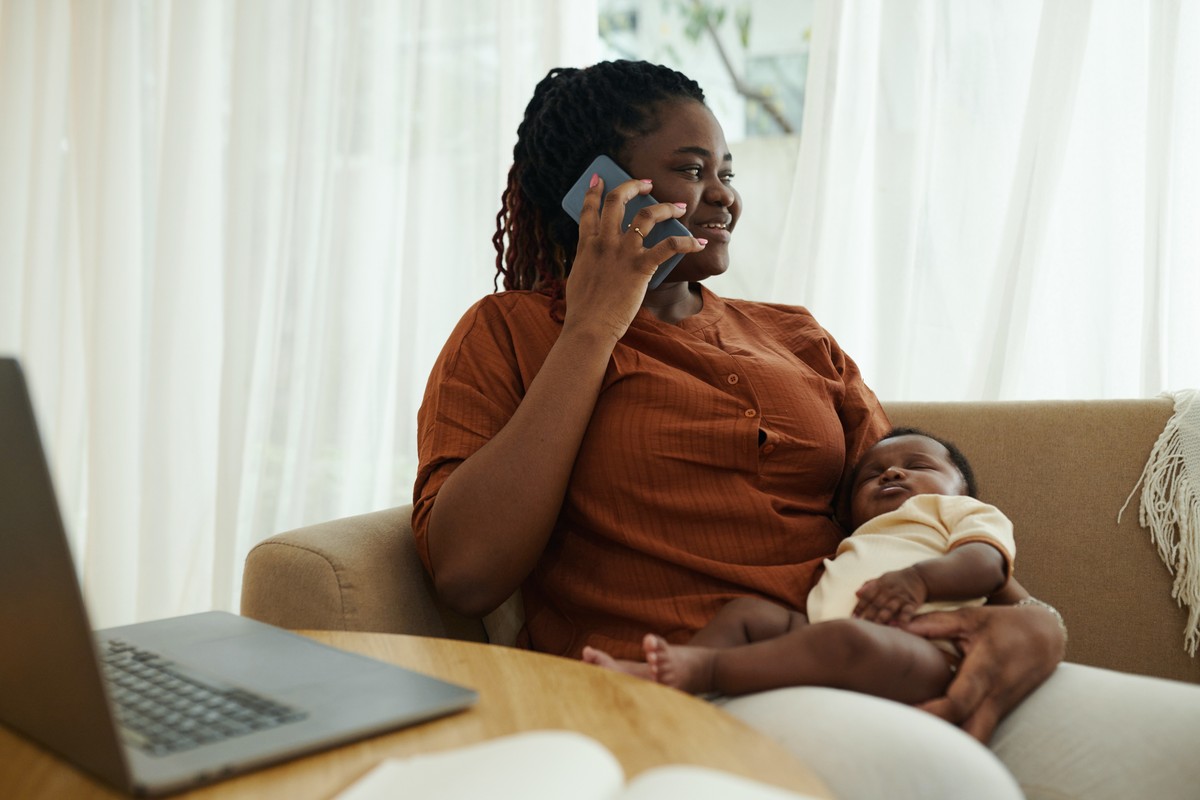 A young woman talking on her phone while expressing frustration or annoyance.
